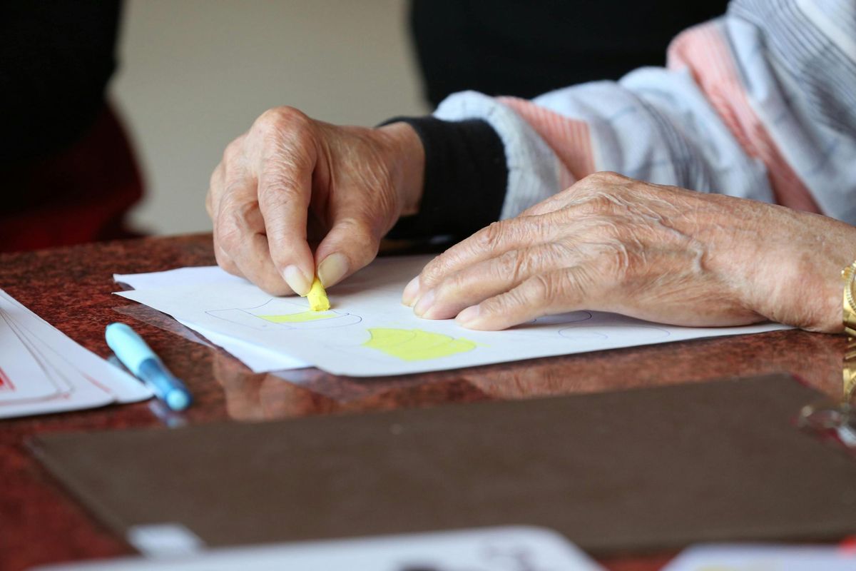 A caregiver spending time with a client at home